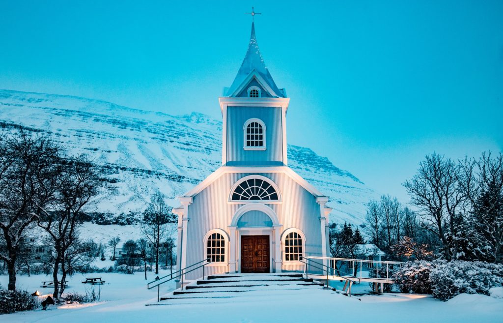 blue church during winter season